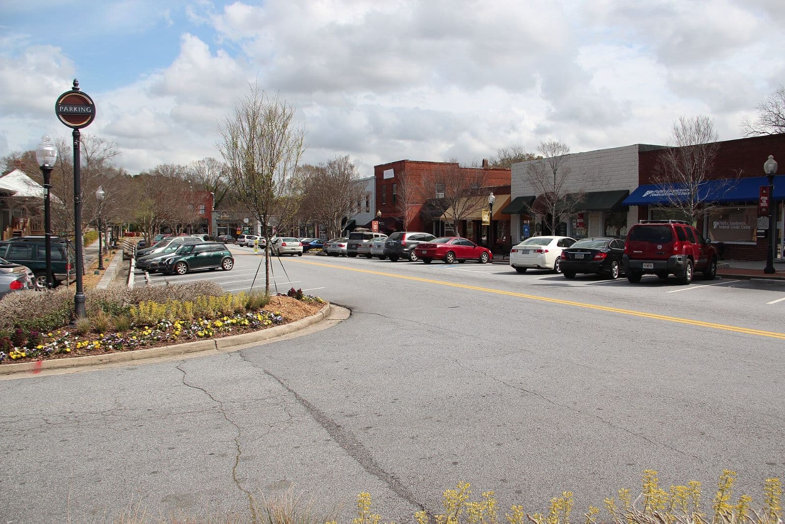 Street view of downtown Norcross storefronts and landscaped median