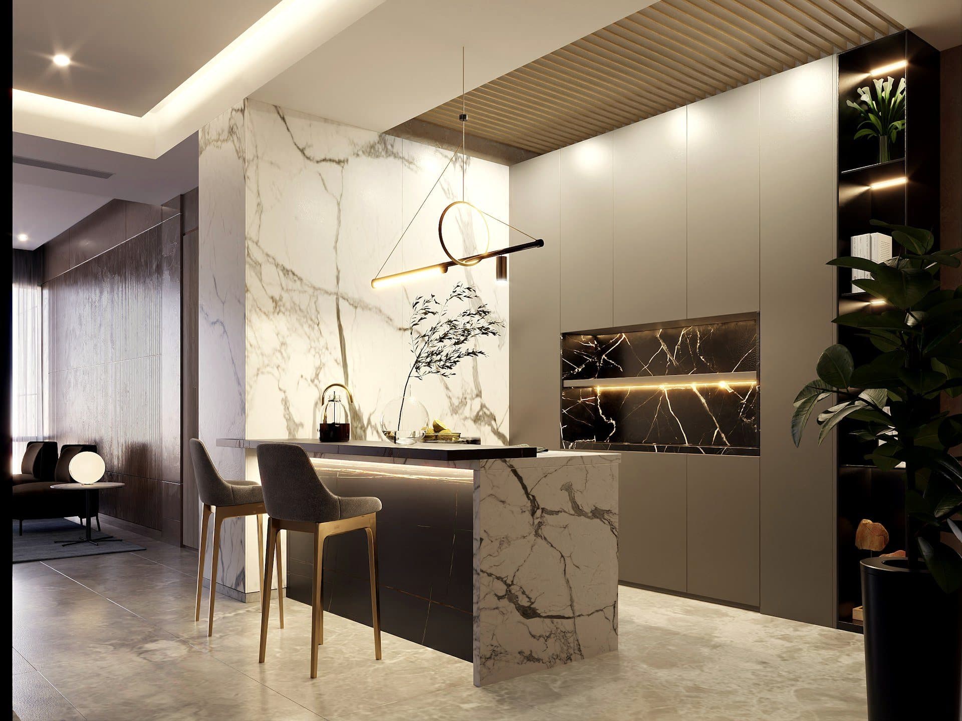 A kitchen with a sculptural marble island and warm pendant light