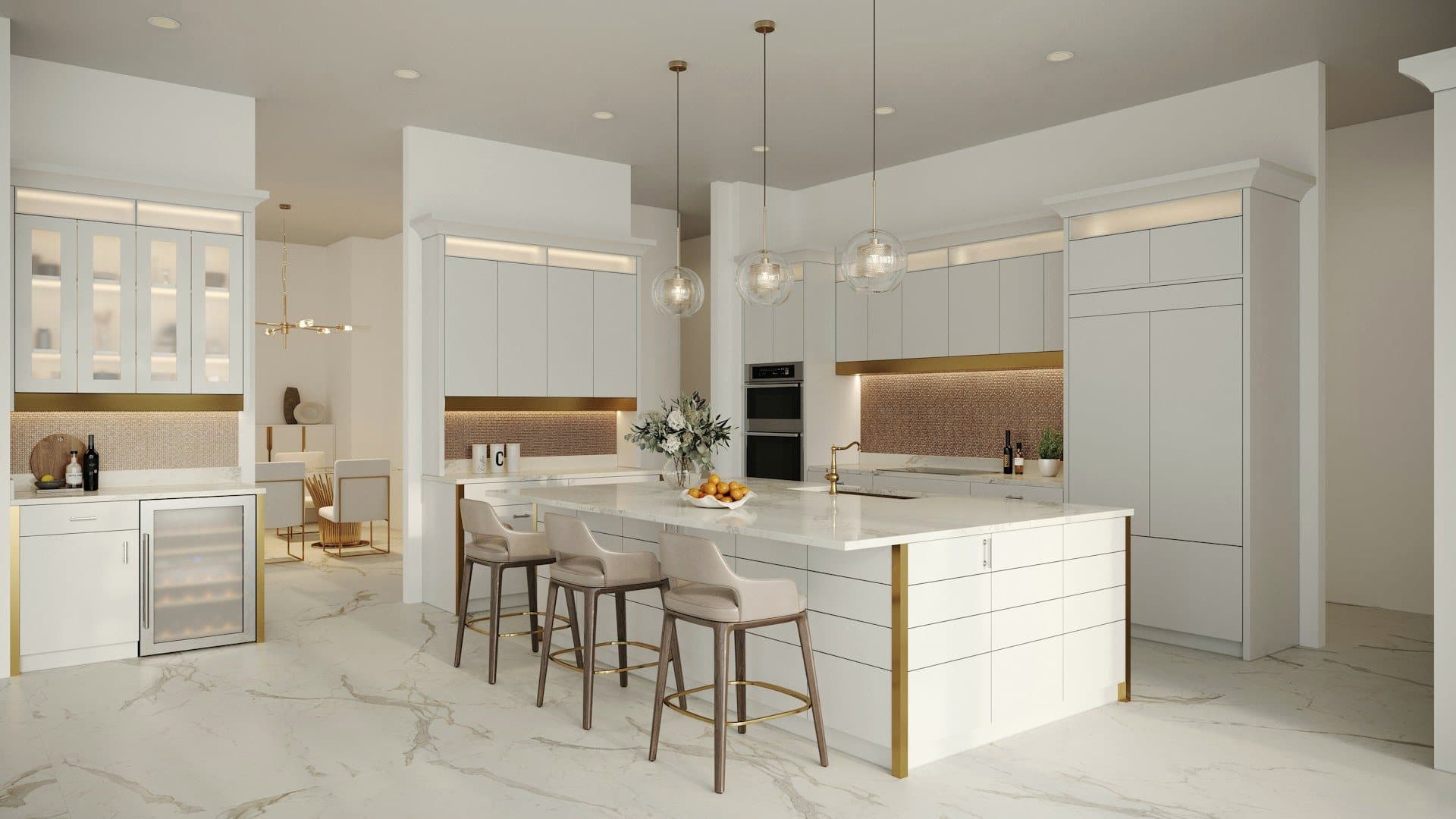 A white marble kitchen with brass details and a large island